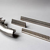 Detail of a turbine disc broaching tool with workpiece (left)